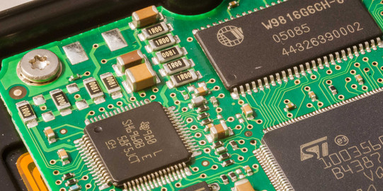 A close-up of a computer board in green.