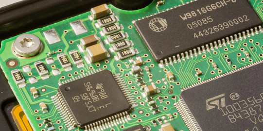 A close-up of a computer board in green.